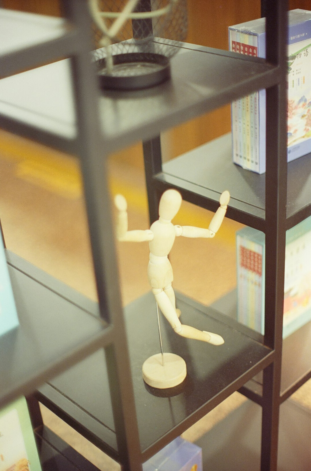 Stack of medical textbooks on a wooden shelf